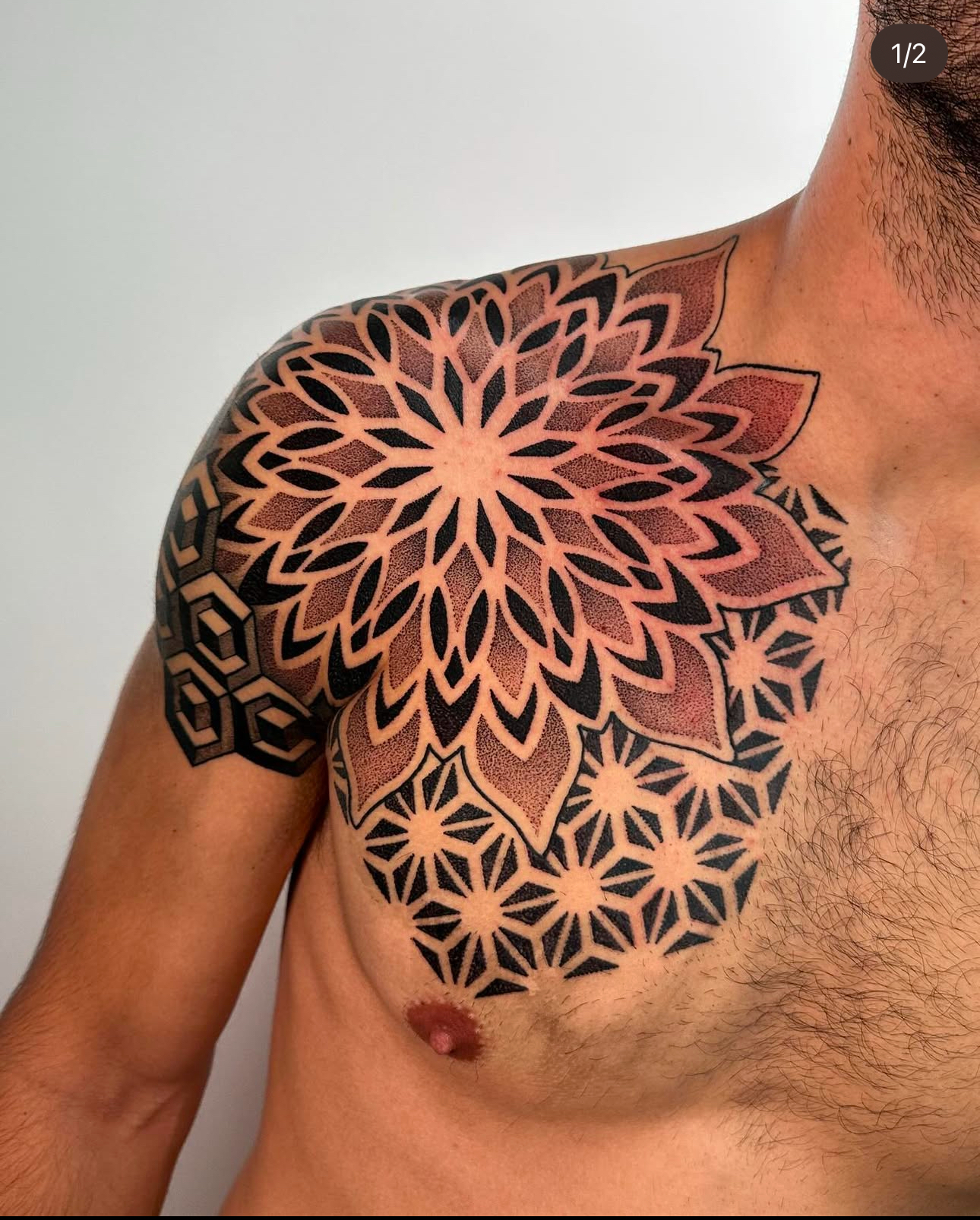 Healed chest and neck geometric tattoo